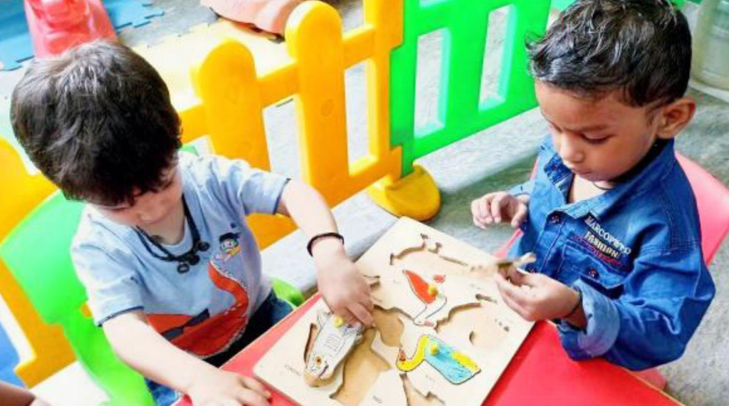 Children playing with a puzzle.