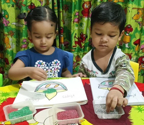 Children crafting with colorful materials.